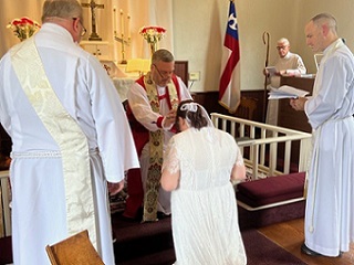 A baptism before Sunday service at St. Andrew's Anglican Church
