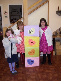 Children's Sunday school time at The Woodcarving Place with children designing a religious plaque